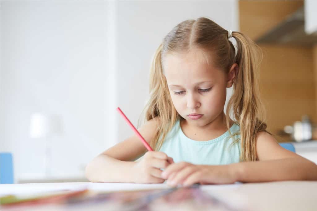 photo of a girl writing